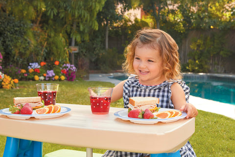 Little Tikes Easy Store Picnic Table features cup holders and a tray for snacks and crayons.