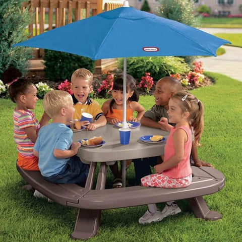 Little Tikes market umbrella centered in the table, providing shade during playtime