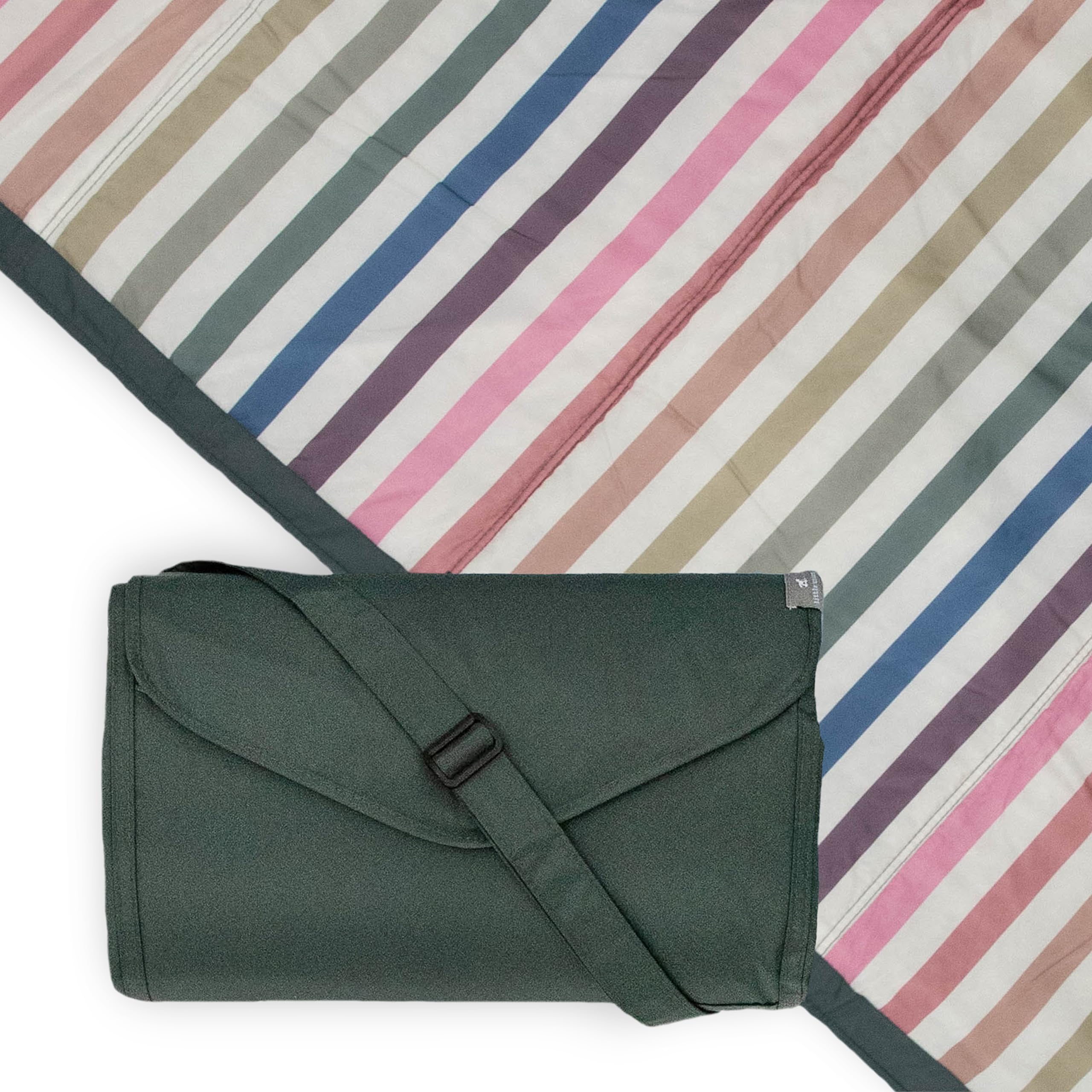 Little Unicorn 5x7 outdoor blanket stretched on grass, water-resistant for easy picnics.