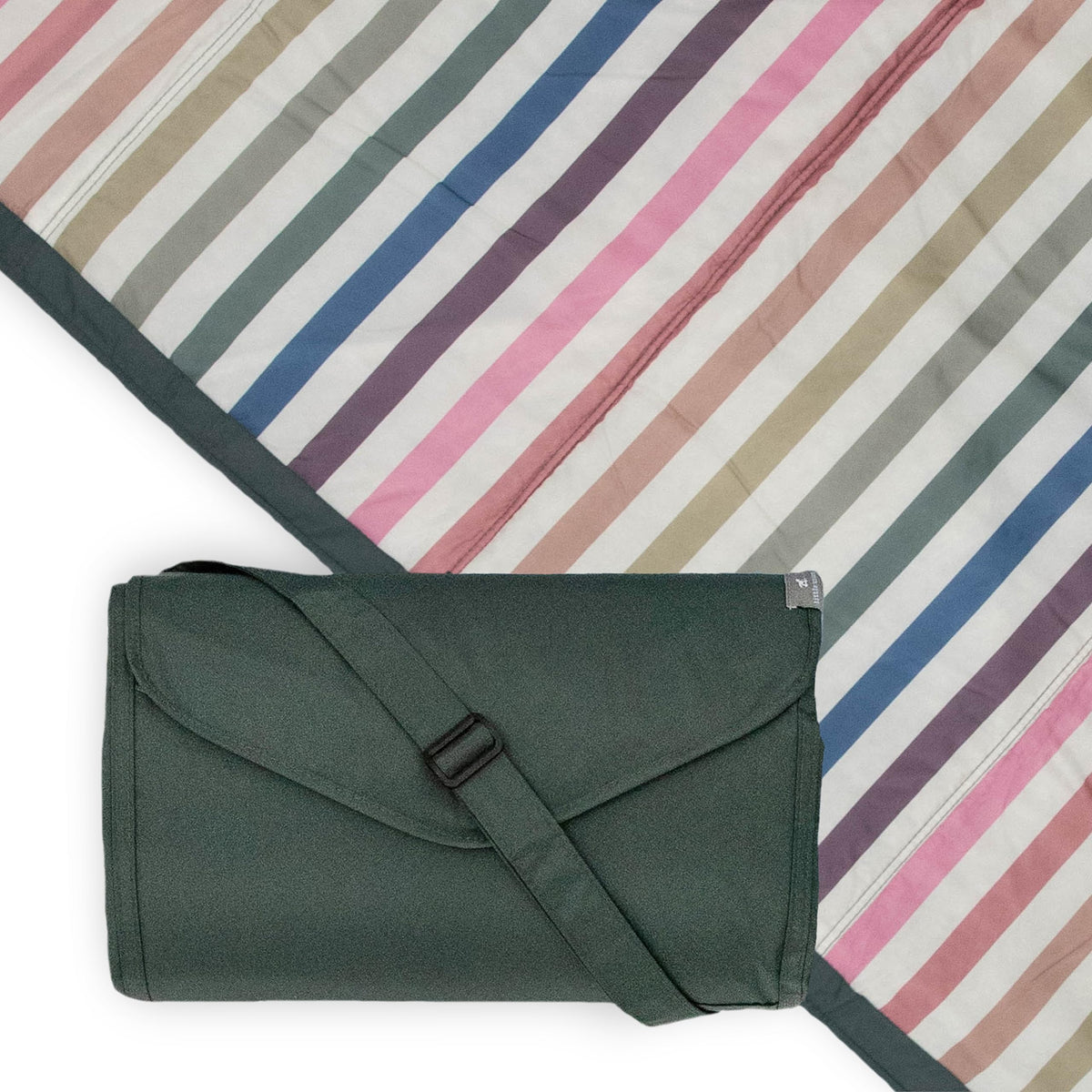 Little Unicorn 5x7 outdoor blanket stretched on grass, water-resistant for easy picnics.