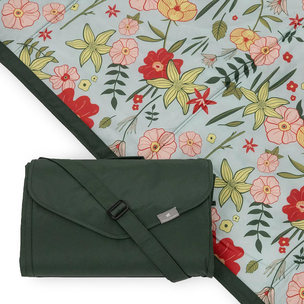 Little Unicorn outdoor blanket folded compactly for travel, easy to carry.