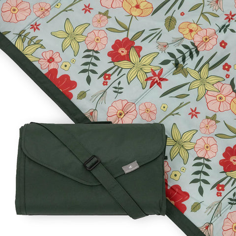 Little Unicorn outdoor blanket folded compactly for travel, easy to carry.
