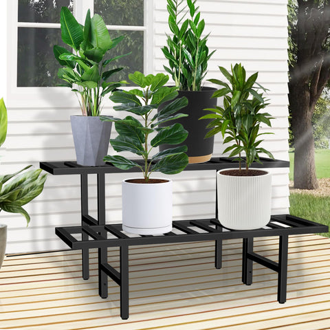 LLAXERGU heavy-duty iron plant stand shown on a patio with large pots.