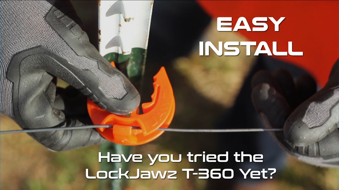 LockJawz orange insulator mounted on a post.
