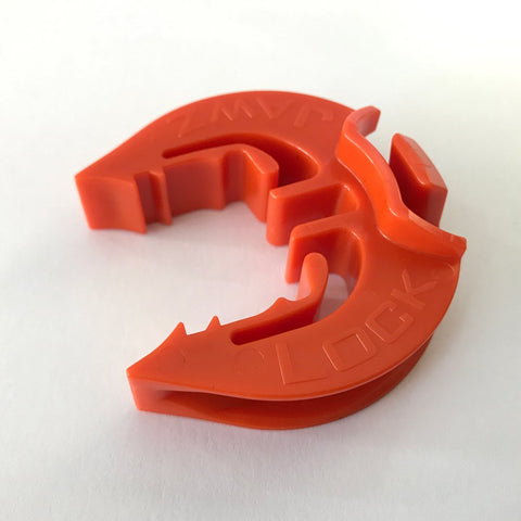 LockJawz T-Post insulator orange close-up shows rugged, weather-ready design.