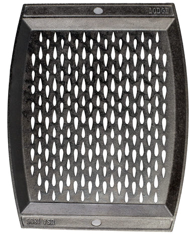 Lodge cast-iron grill topper with teardrop perforations for smoky grill flavor.