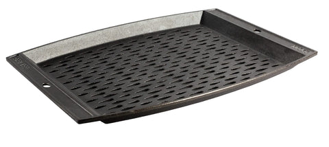 Lodge pre-seasoned grill topper on rectangle surface preserves food while grilling.