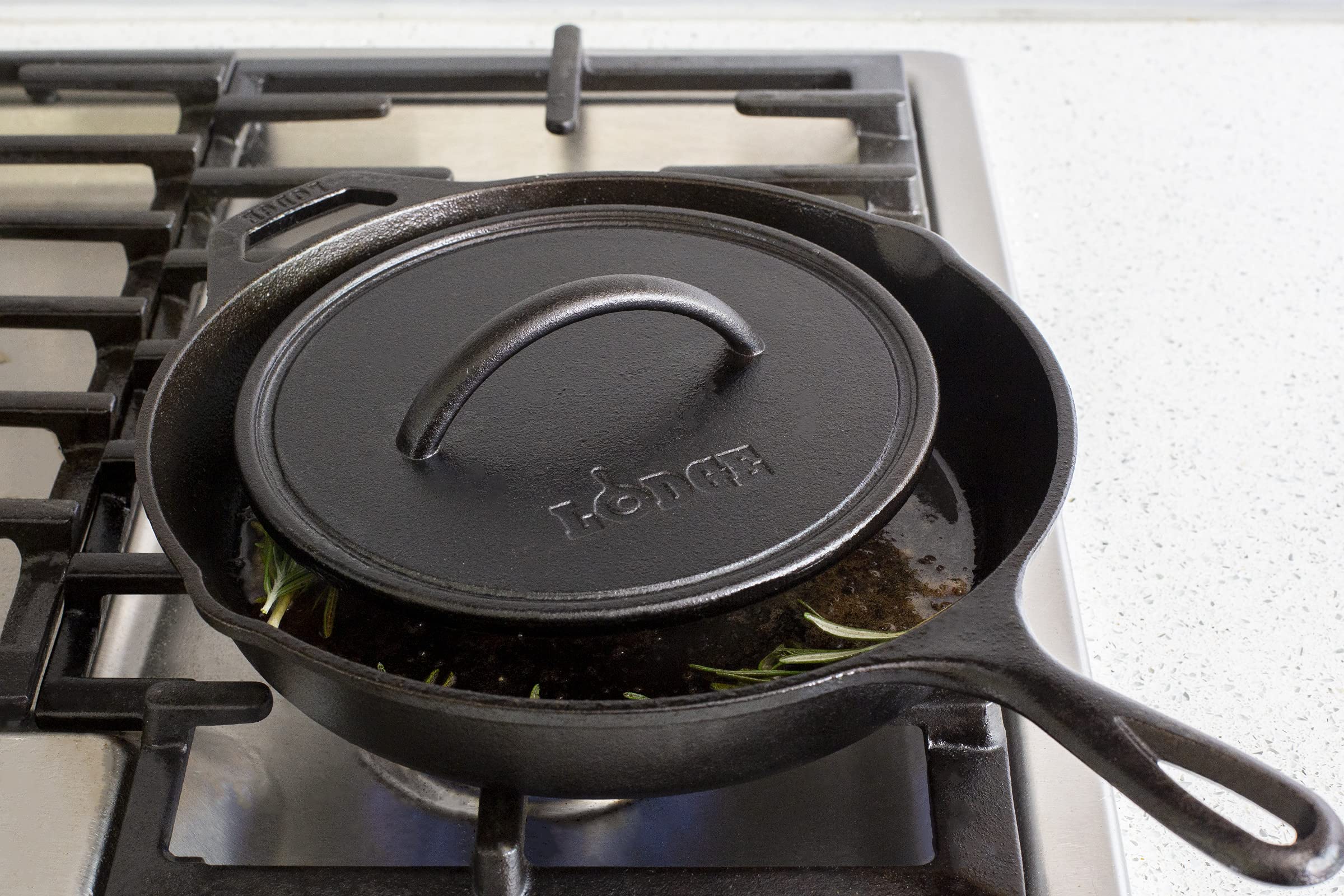 Lodge cast iron press on stovetop for even searing and fat reduction.