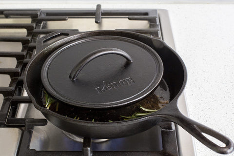 Lodge cast iron press on stovetop for even searing and fat reduction.