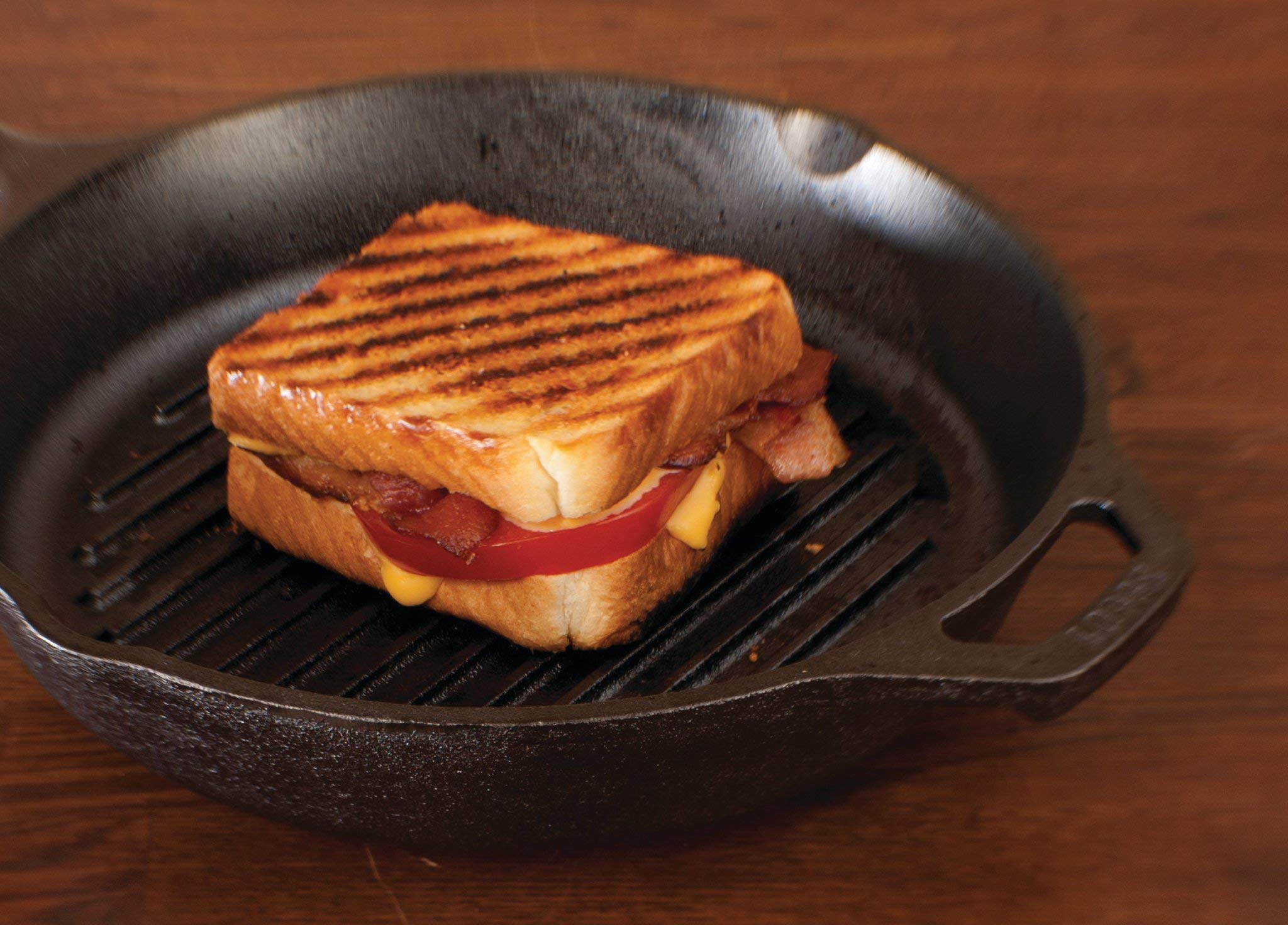 Lodge scraper made of heat-resistant polycarbonate; dishwasher safe for easy cleanup.