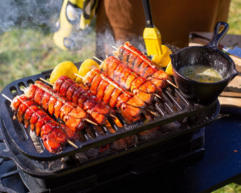 Lodge Sportsman's Pro Grill in a tailgate setup for hearty meals.