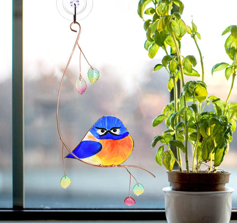 Lolitarcrafts bluebird stained glass ornament adds color to a room