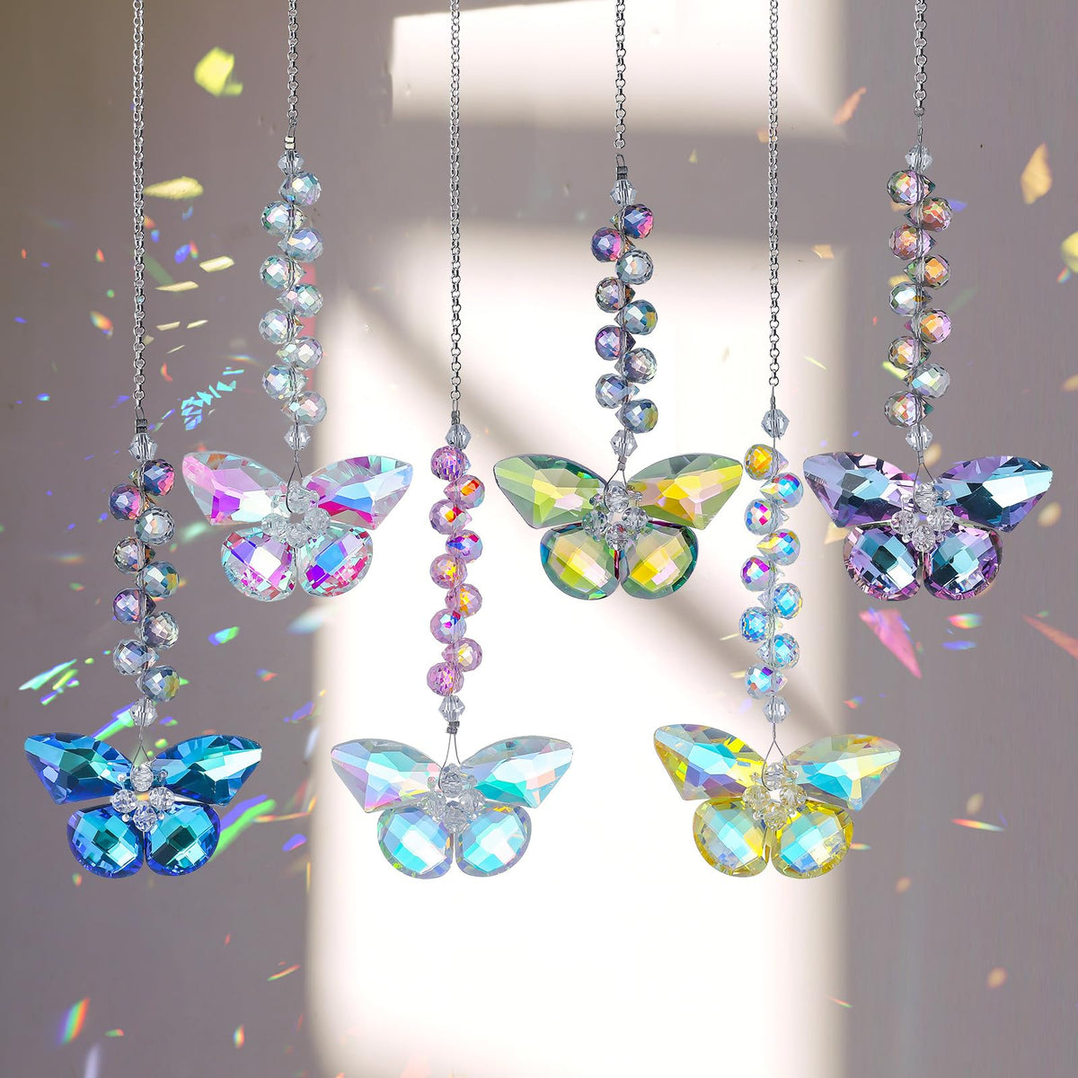 Longsheng crystal butterfly suncatcher casting vivid rainbows on sunlit windows.