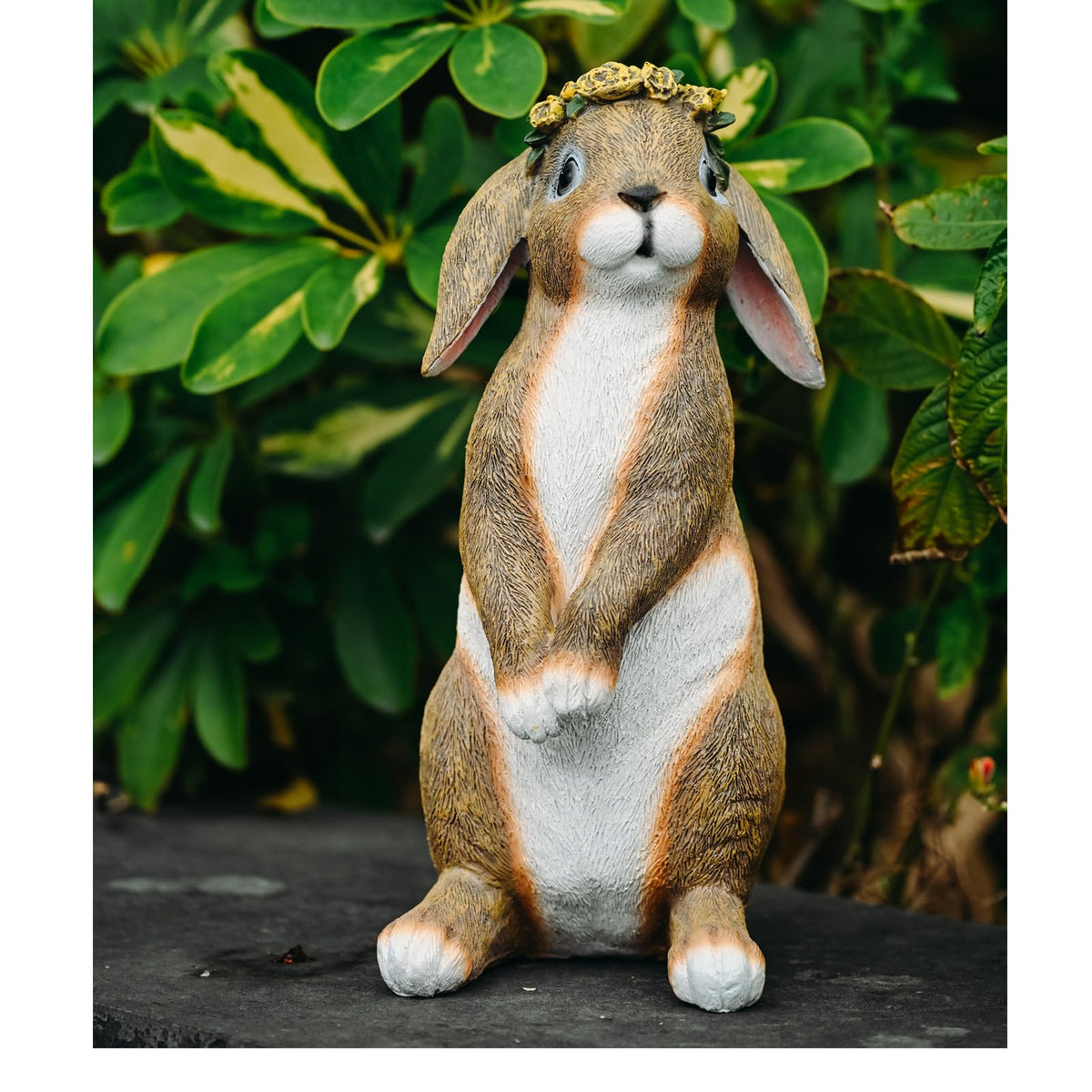 Lonyin Deco bunny garden statue perched beside stepping stones for garden charm