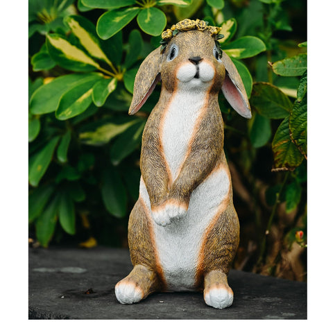 Lonyin Deco bunny garden statue perched beside stepping stones for garden charm
