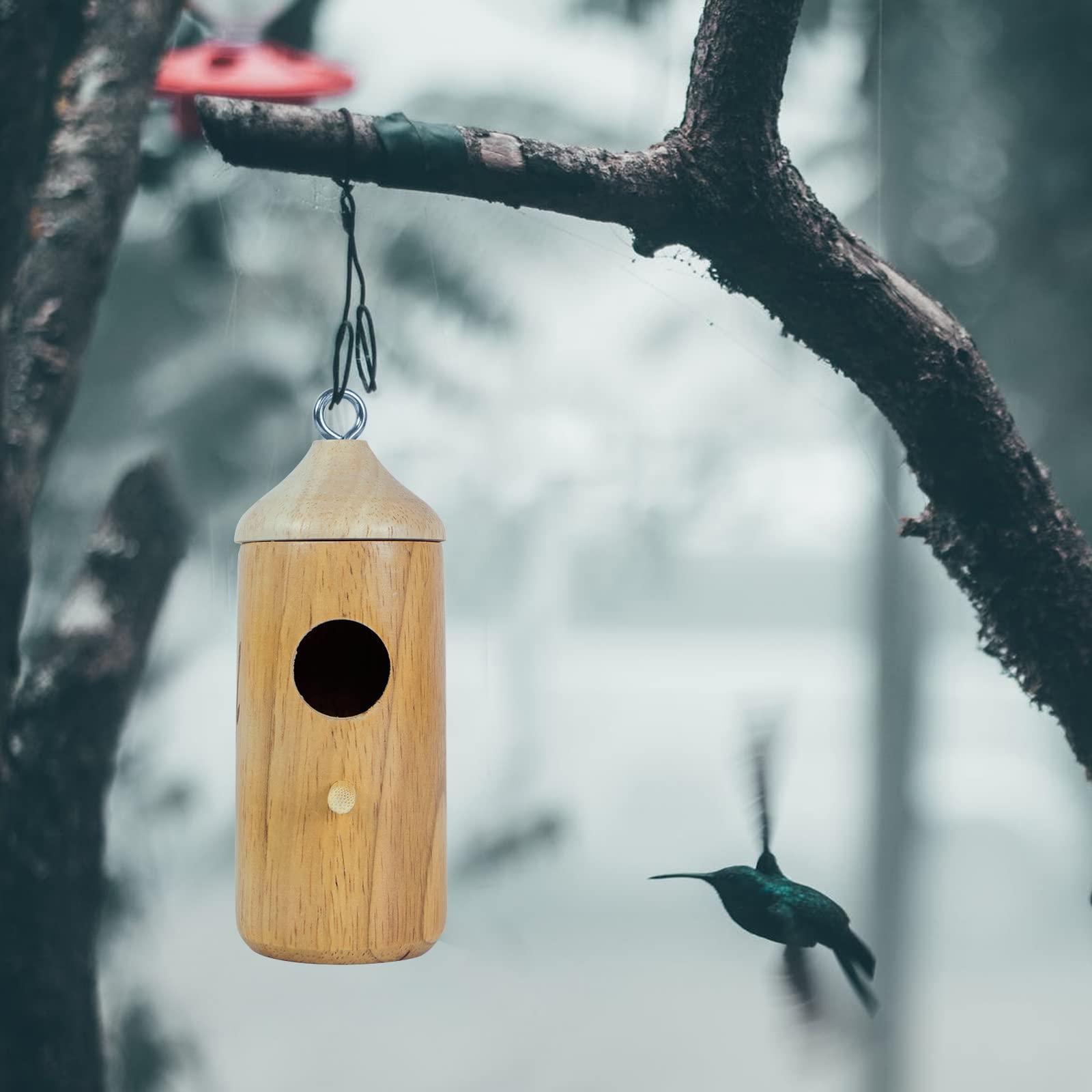 LOTKEY hummingbird house mounted on a tree or stake for outdoor use.