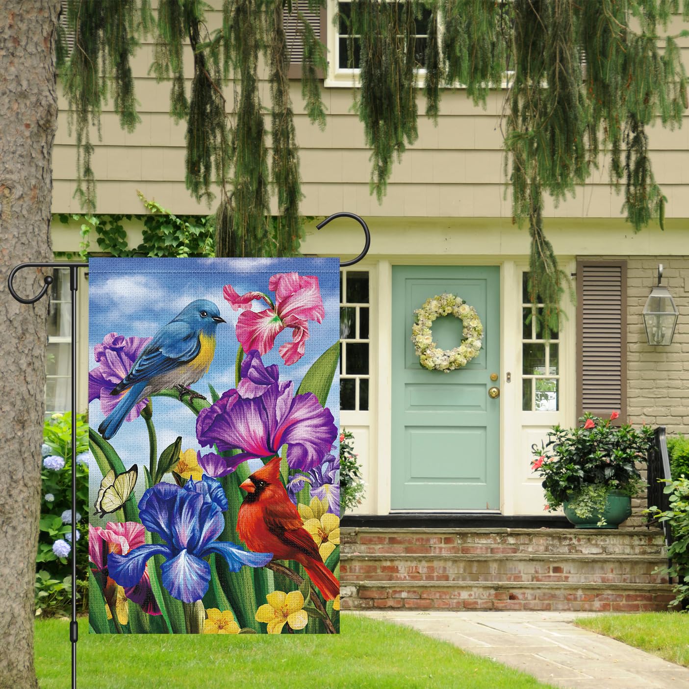 Louise Maelys burlap garden flag shows spring flowers and cardinals in durable material.