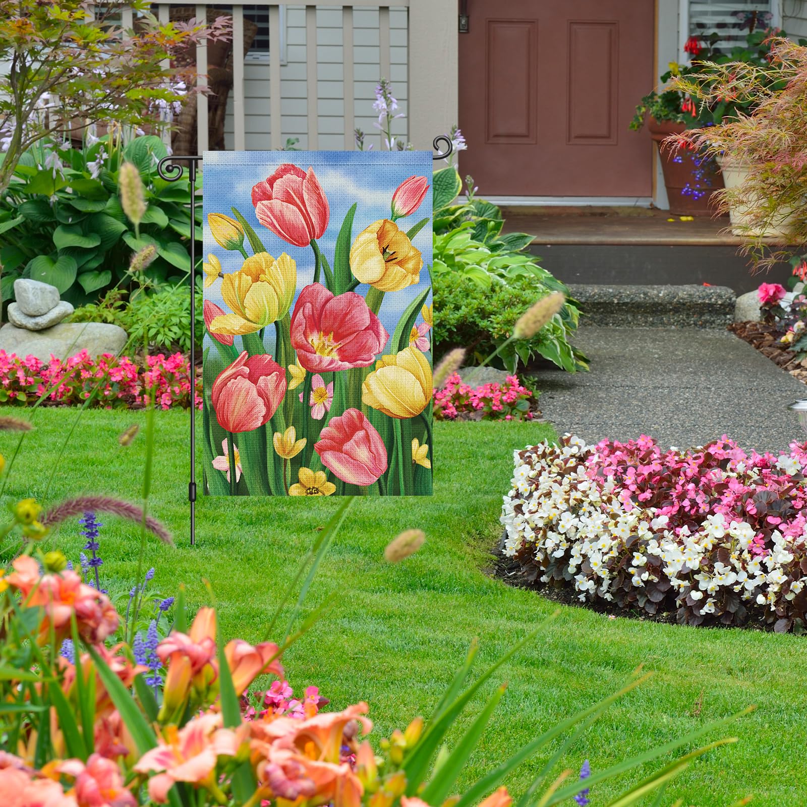 Louise Maelys garden flag shows tulips from both sides with vibrant motifs.
