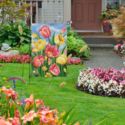 Louise Maelys garden flag shows tulips from both sides with vibrant motifs.