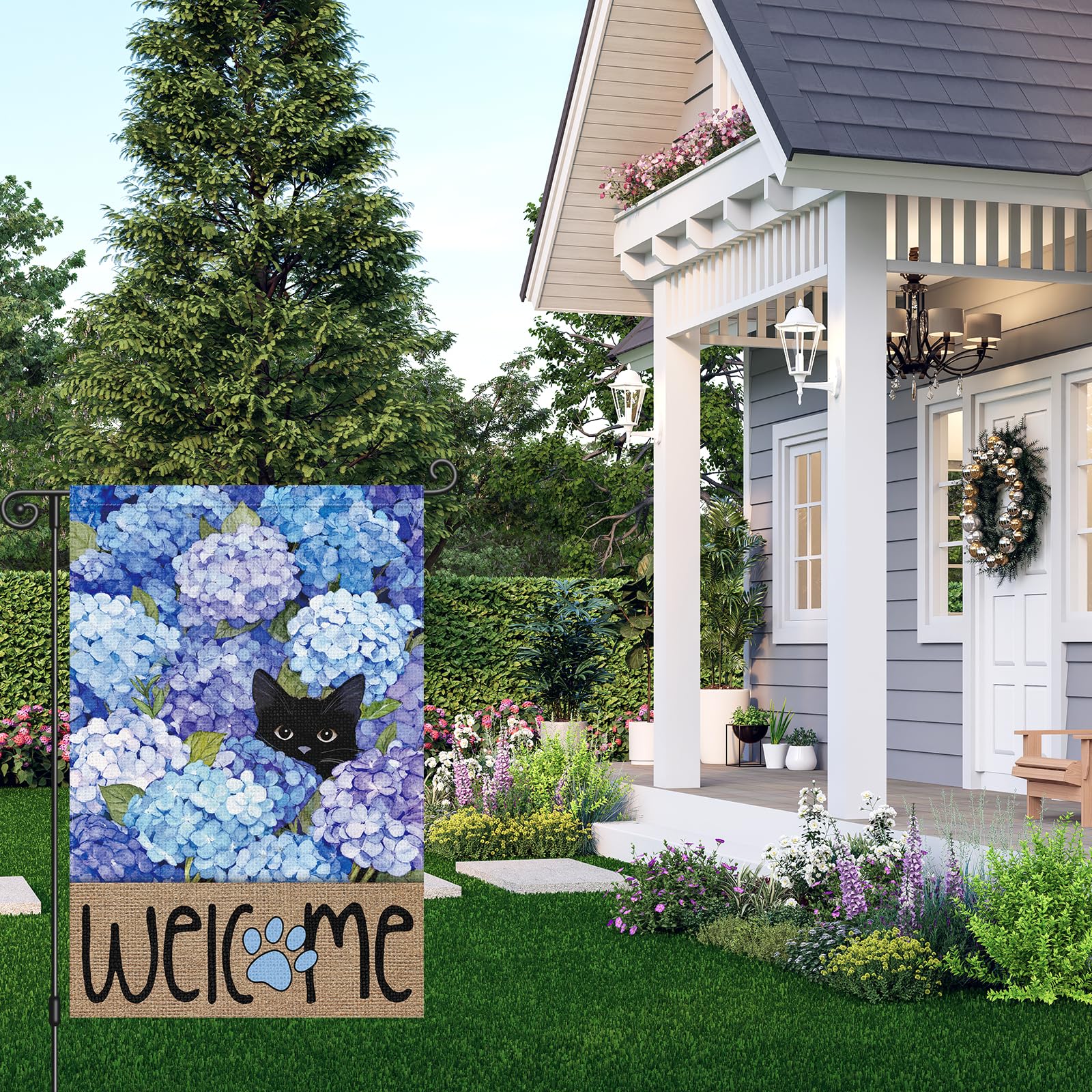 Louise Maelys hydrangea and cat flag features double-sided printing for visibility from both sides.
