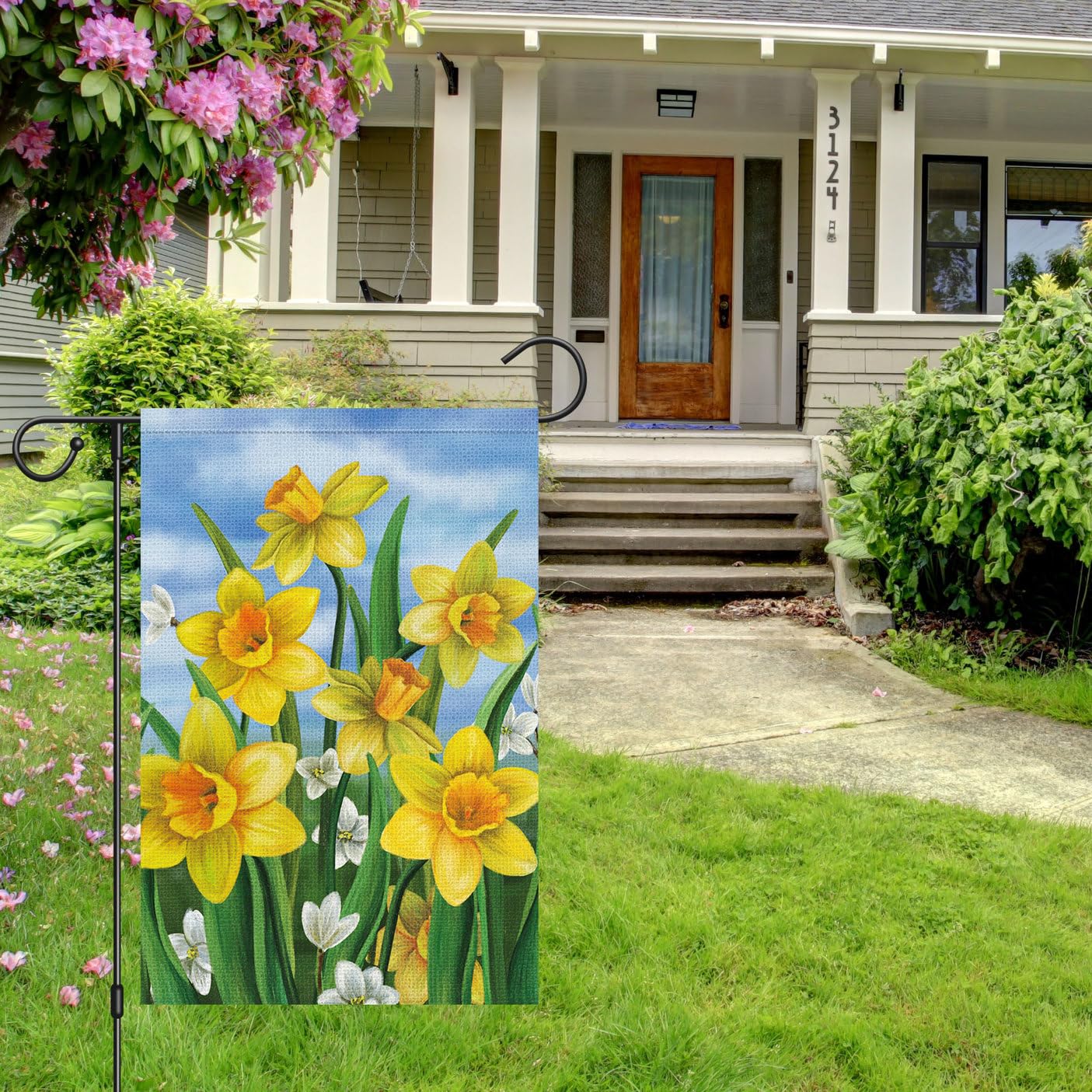 Louise Maelys burlap garden flag material adds rustic charm and durability.