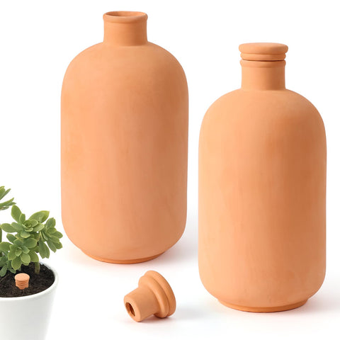 Lovely Ran ollas terracotta pots set displayed in soil for steady moisture.