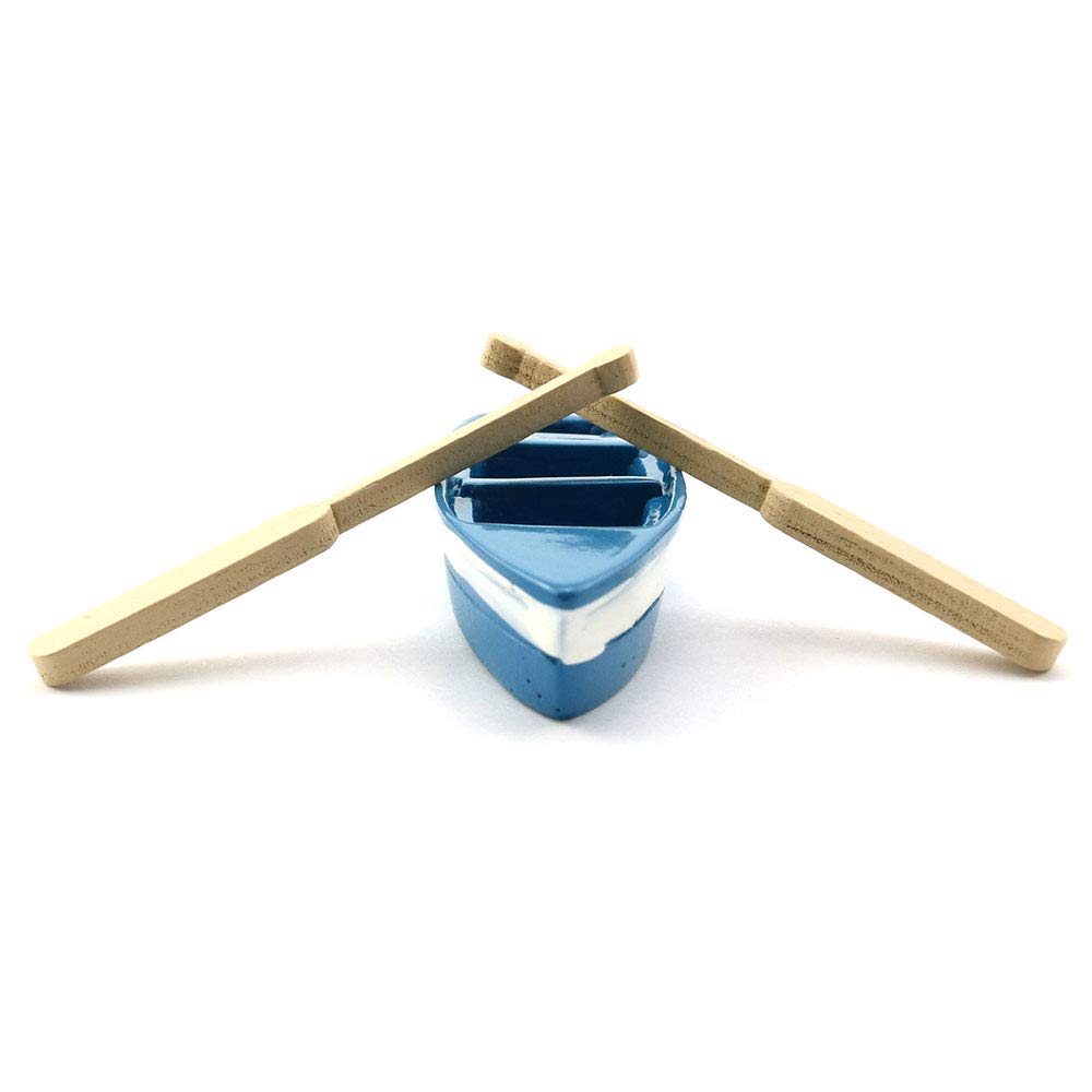 LQ Industrial plastic boat with oars for cake toppers or displays.