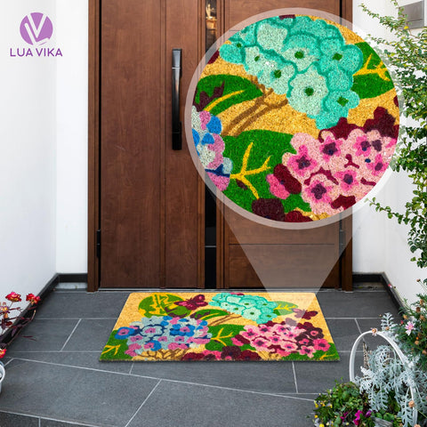 LUA VIKA coir door mat welcomes guests at the front door with a non-slip base.