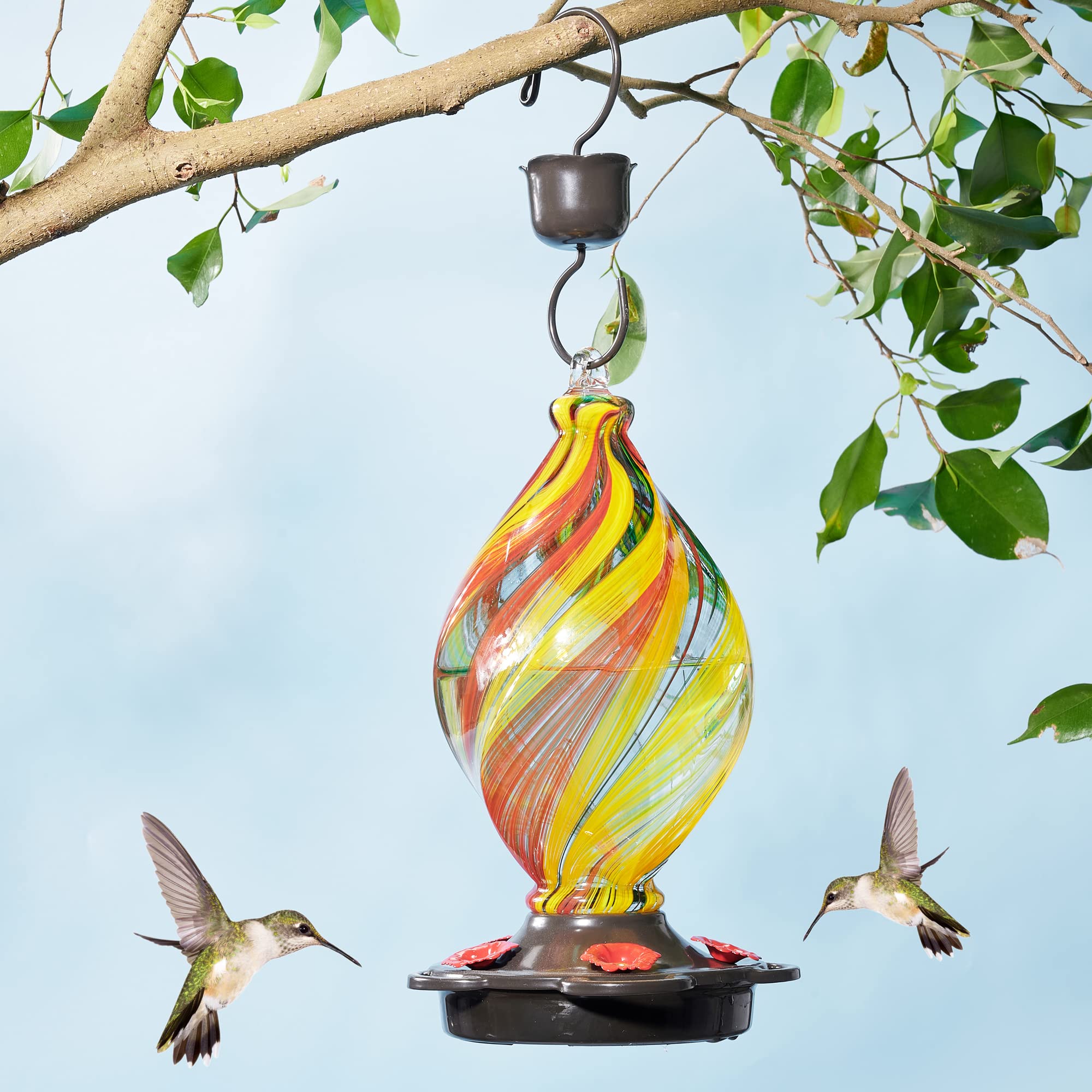 LUJII hand-blown glass hummingbird feeder showcases vibrant colors for a lively backyard scene.