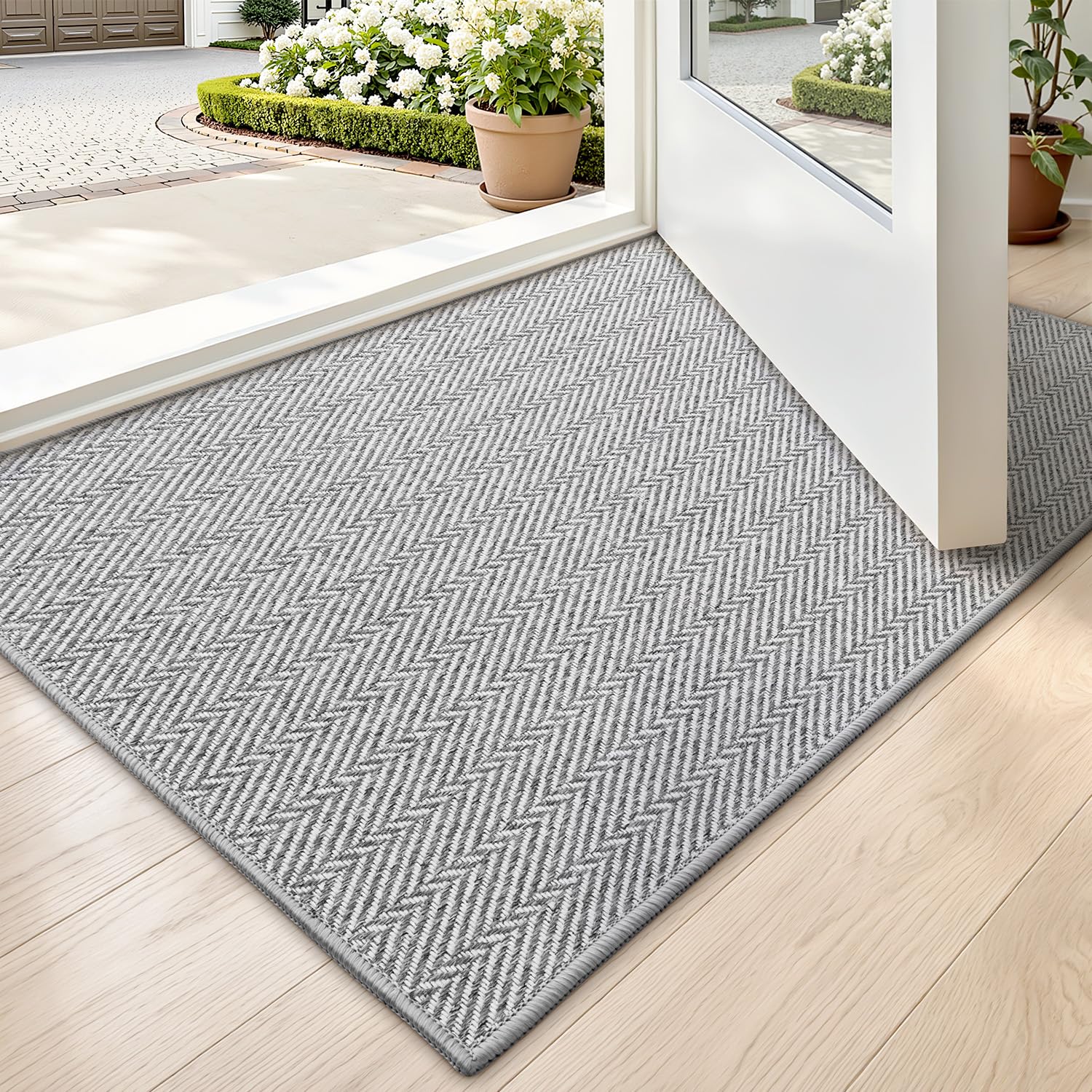 LUMI ultra-thin door mat at the entrance with a sleek gray look for space-saving appeal.