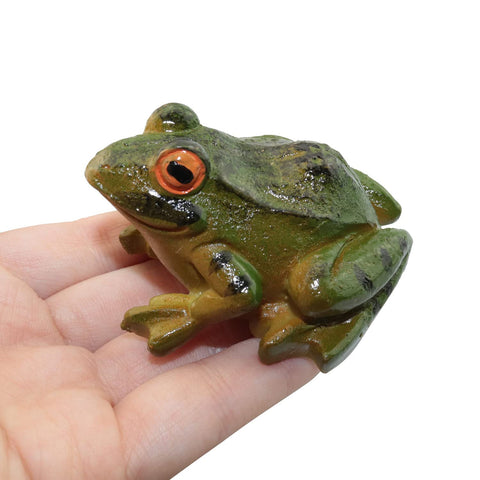 LUORNG resin frog statue in a garden setting adds whimsical outdoor charm.