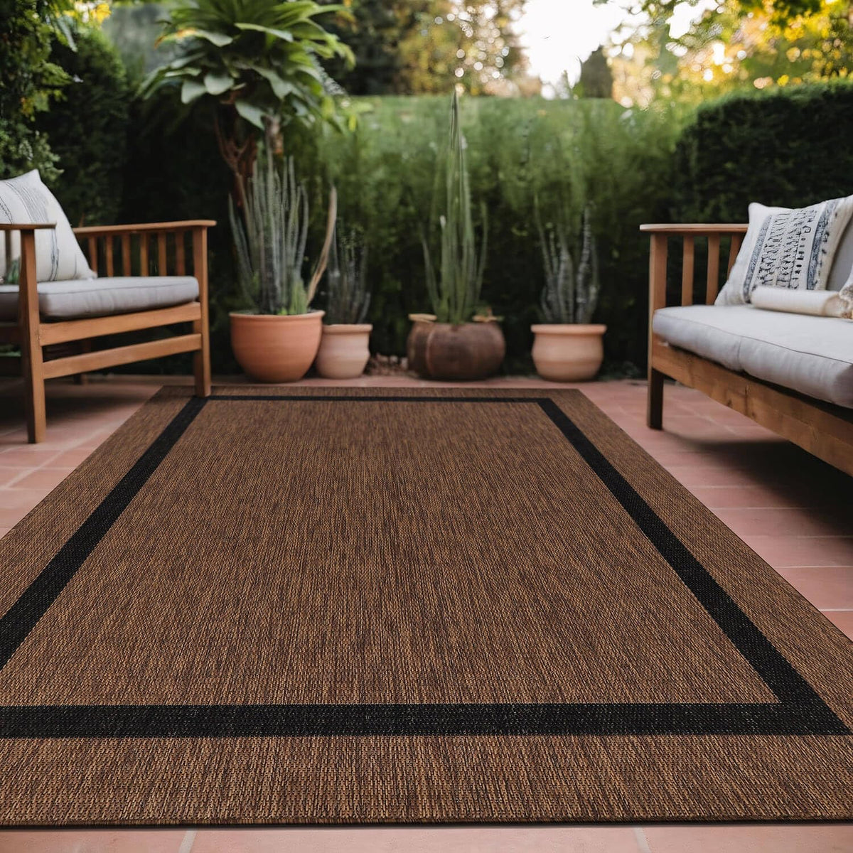 Luul Home bordered outdoor rug 6x9 setup showcases modern patio styling.