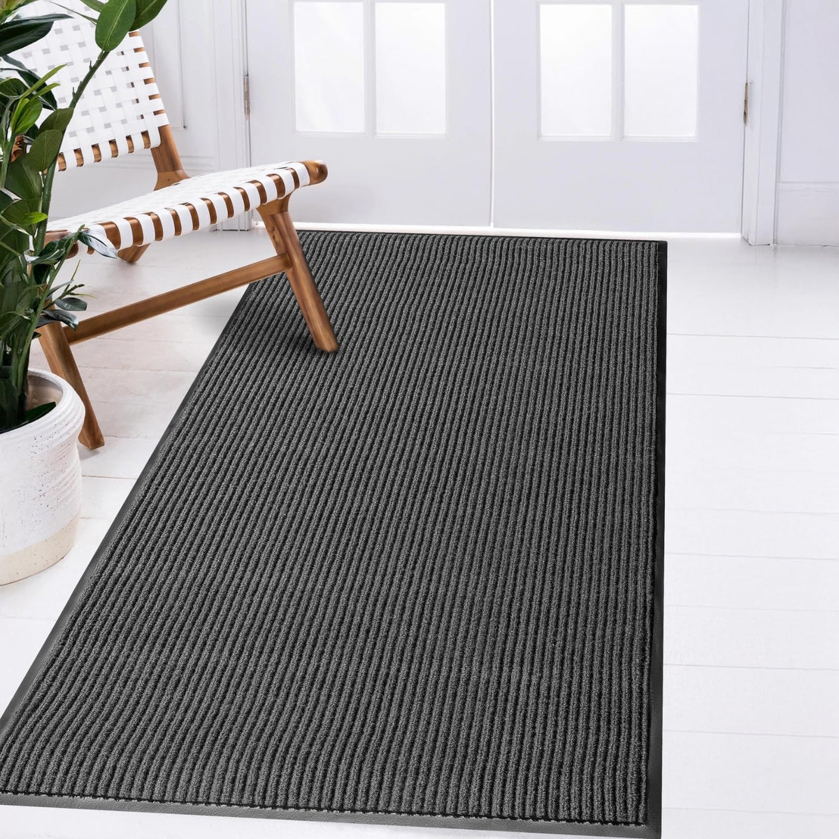 LuxUrux durable rubber entry mat traps dirt and withstands heavy traffic