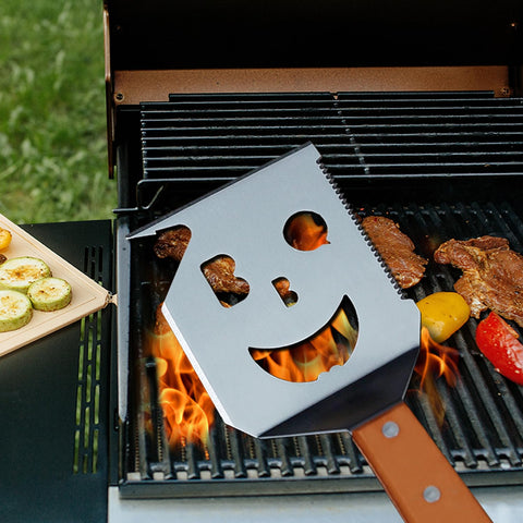 M-HHonger BBQ spatula with smiling-face design enhances backyard grilling experience.