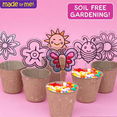 Made By Me suncatcher garden kit daisy brightens a sunny shelf display.
