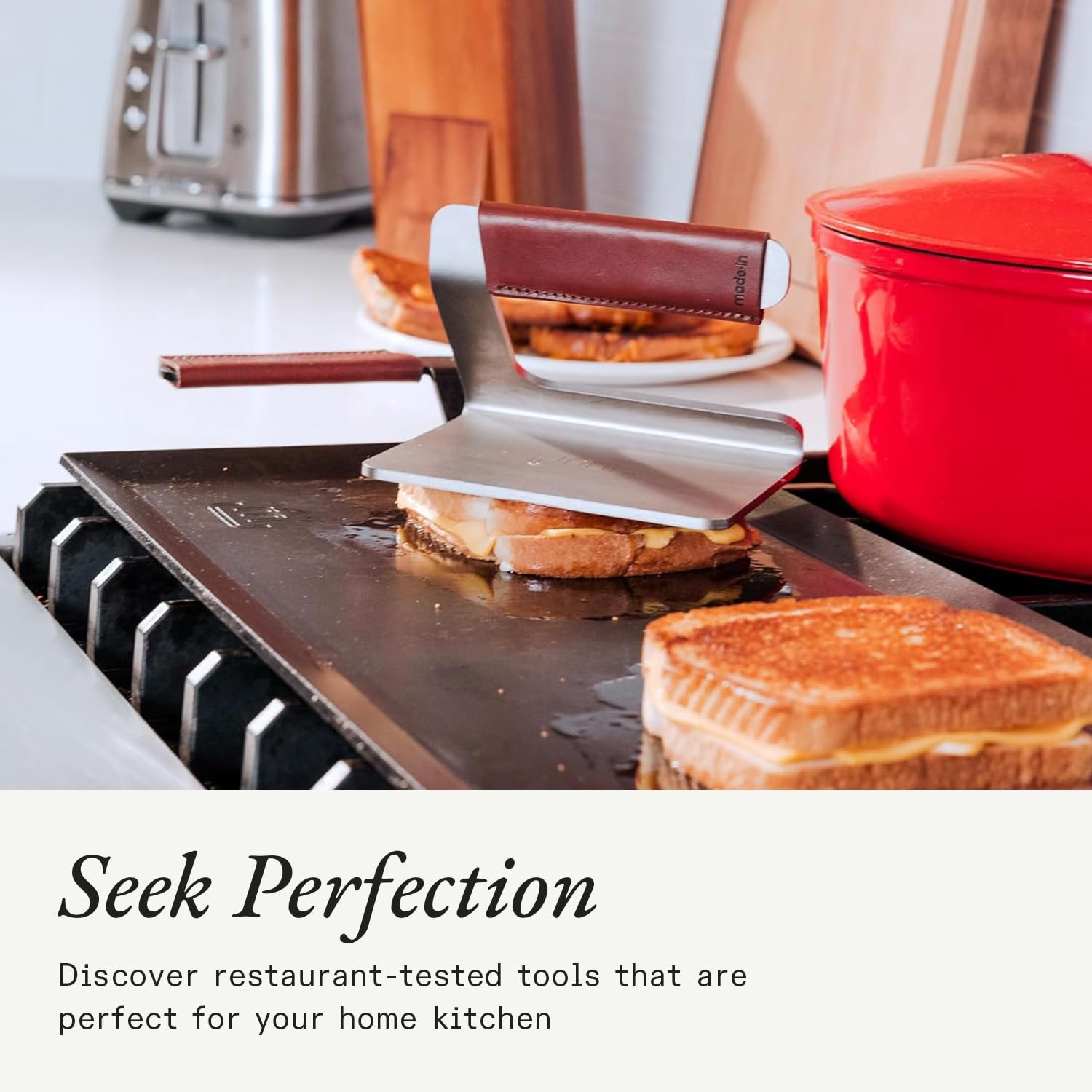 Made In grill press suitable for open fire cooking with durable steel