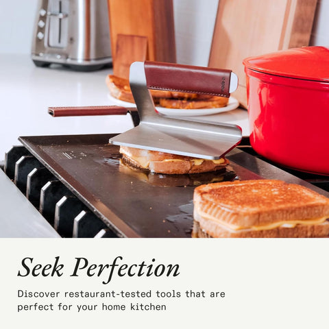 Made In grill press suitable for open fire cooking with durable steel