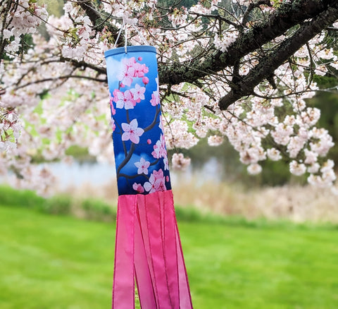 Madrona Brands windsock pink and blue tails fluttering in breeze add whimsy to patios