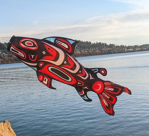 Madrona Brands Totem Salmon Windsock bold patterns enhance garden appeal.