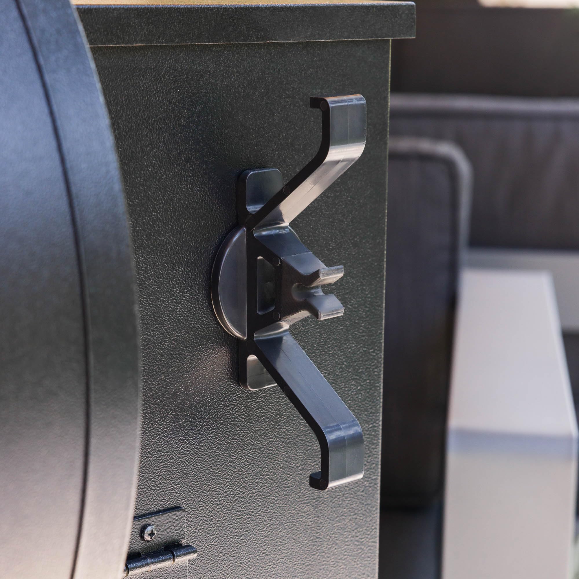 Magna Outdoors organizer attached to powder-coated steel grill surface shows easy installation