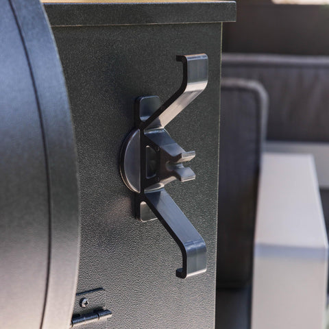 Magna Outdoors organizer attached to powder-coated steel grill surface shows easy installation