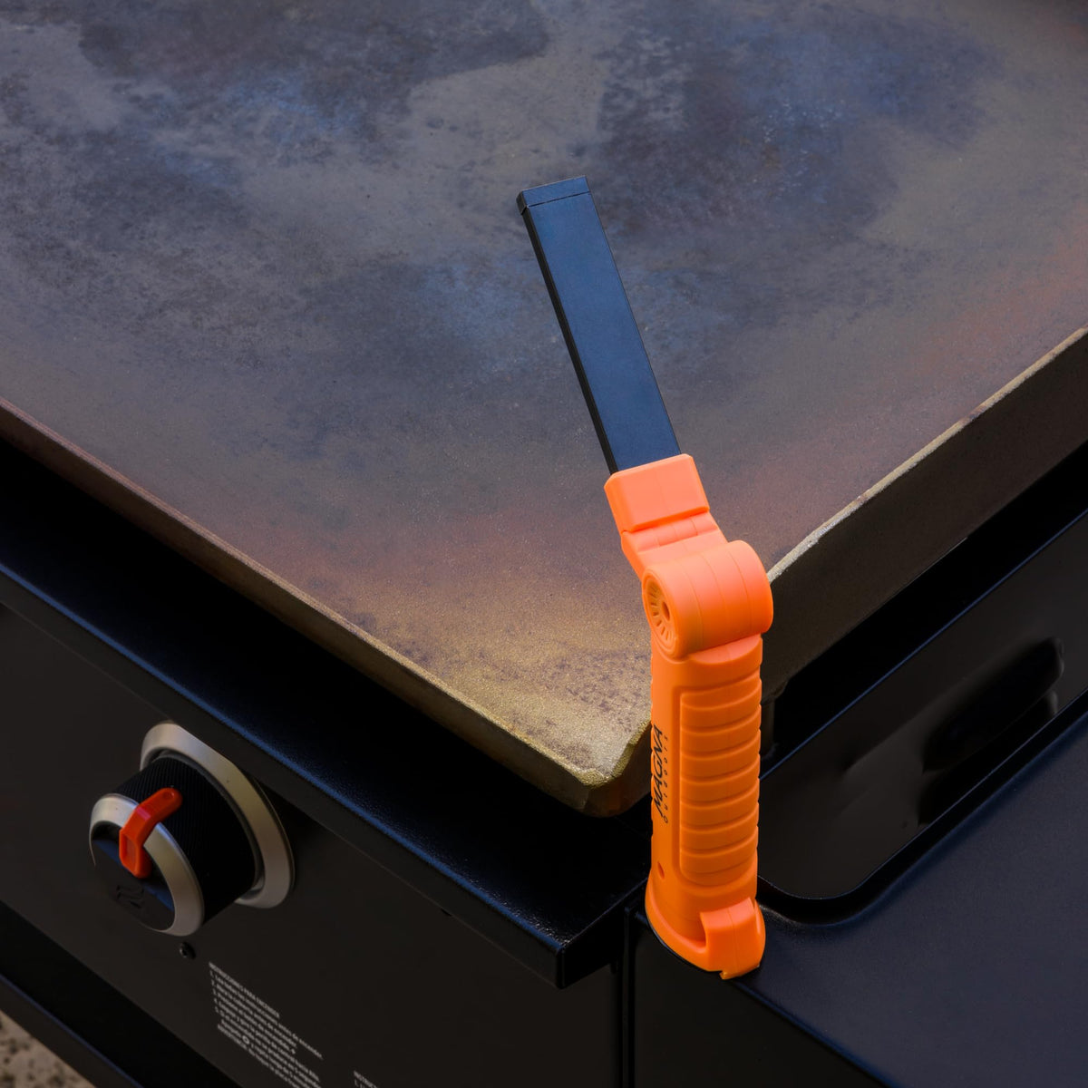 Magna Outdoors griddle night light attached to a steel shelf for bright night grilling.