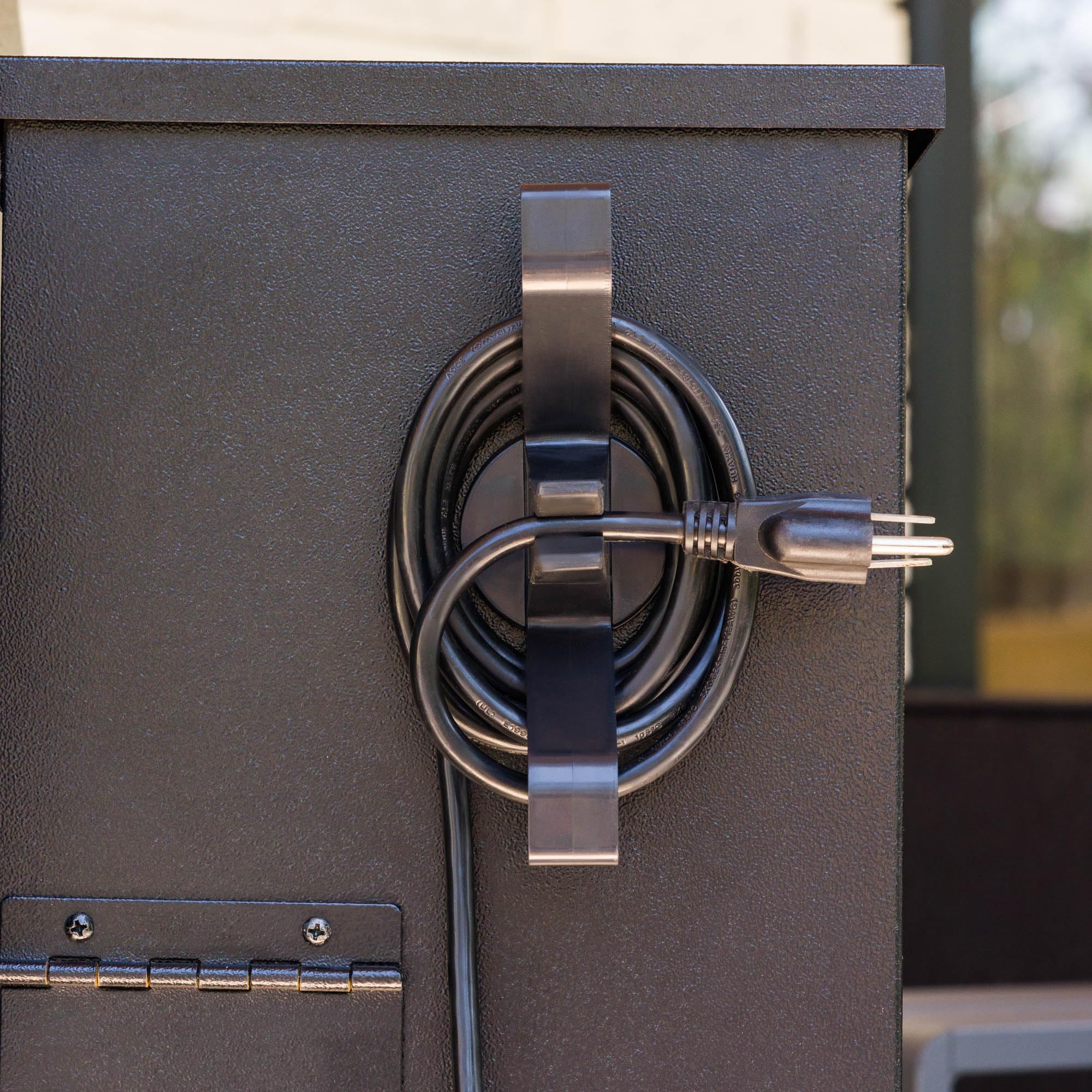 Magna Outdoors magnetic wrap neatly coils the cord to prevent tangles while grilling