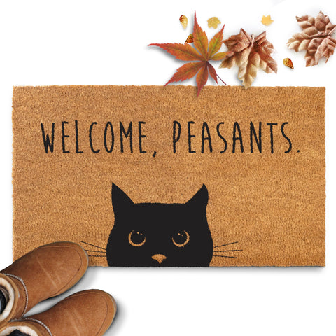 MAINEVENT Front-door scene shows a welcoming cat doormat.