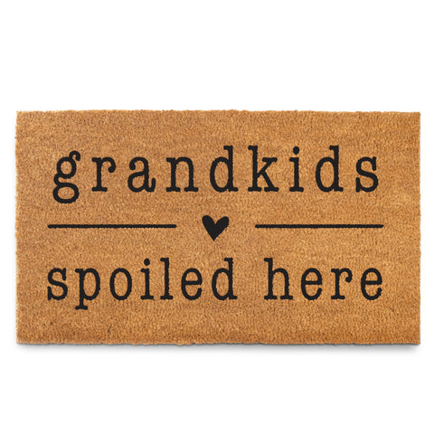 MAINEVENT Grandkids Spoiled Here doormat at entry, welcoming visitors with a playful message.