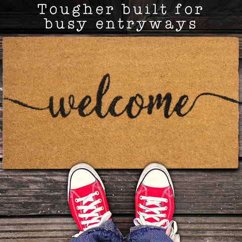 MAINEVENT Script Welcome Mat features thick coco fibers and vibrant paint.