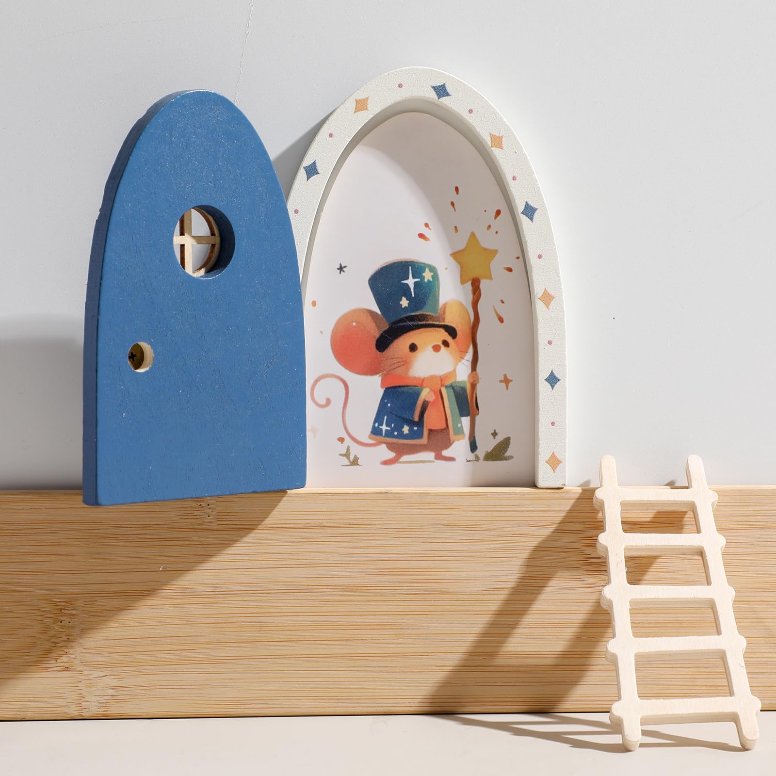 Blue Mamimami Home fairy door with ladder opens for tiny notes and gifts.