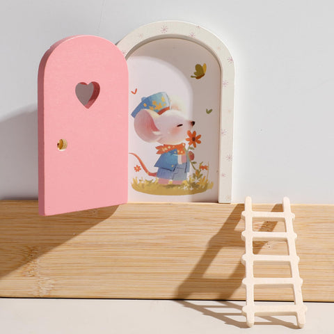 Mamimami Home miniature ladder complements the pink fairy door for stability.