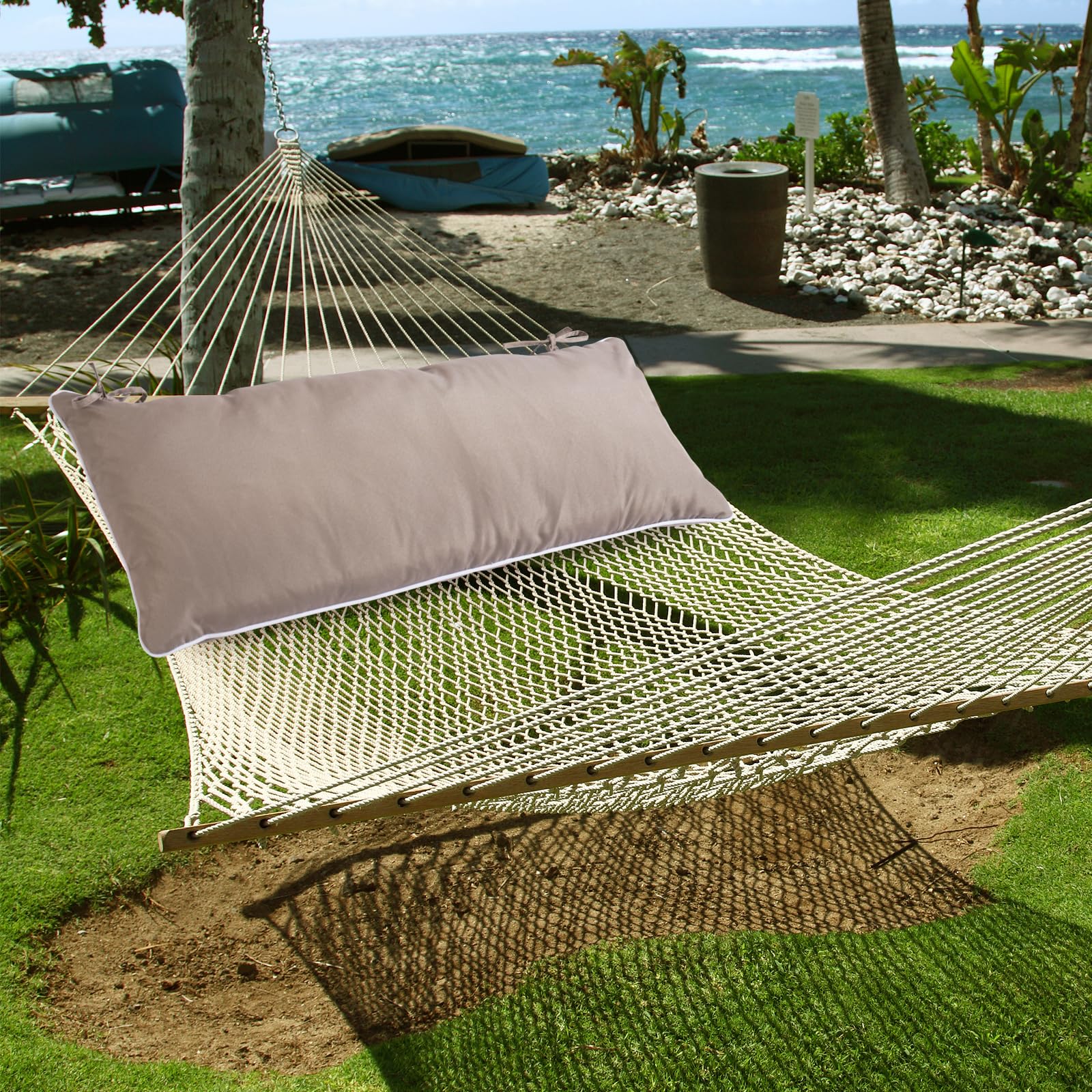 Maphissus hammock pillow used for reading in outdoor setting