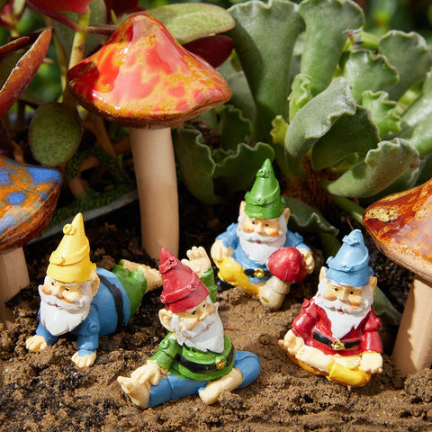 Humorous gnomes in playful poses brighten front yard or fairy garden